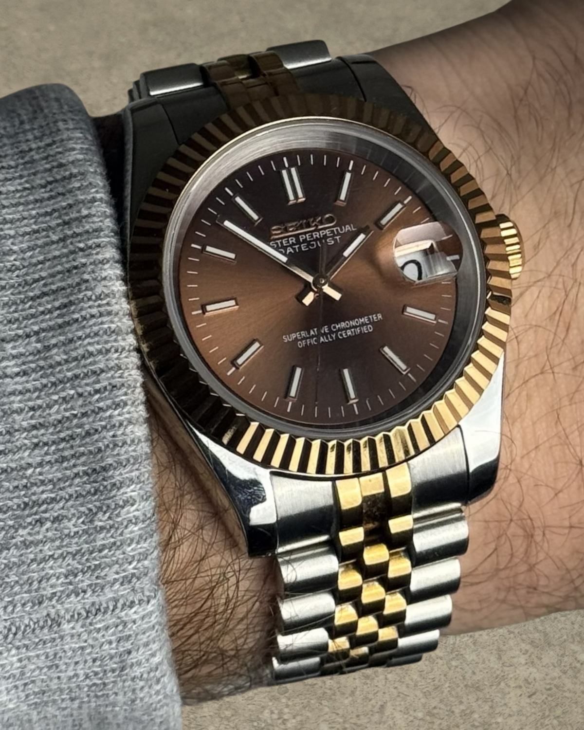 PB TimePiece Classic Date watch with a chocolate dial, fluted bezel, and two-tone rose gold stainless steel bracelet.