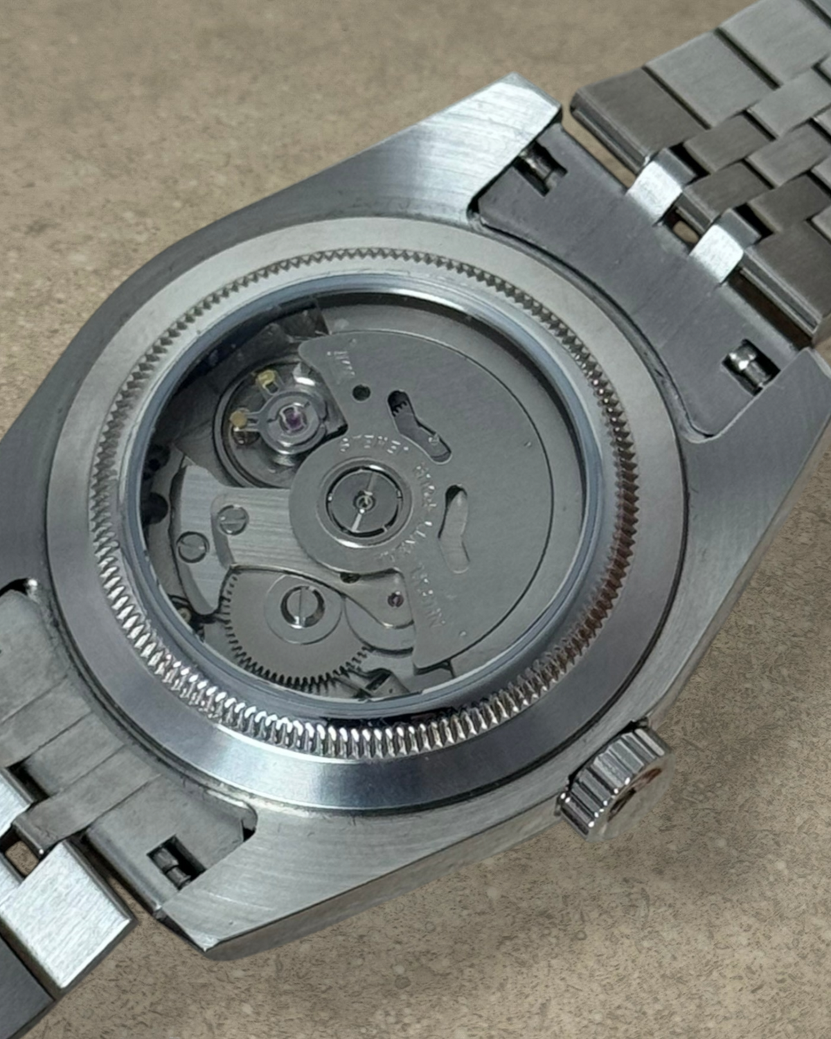 PB TimePiece Classic Date watch showing the stainless steel case back and automatic Seiko NH35 movement exhibition