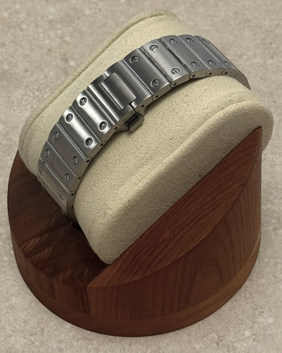 PB TimePiece Aviator Skeleton watch featuring a stainless steel bracelet with butterfly clasp on a display stand