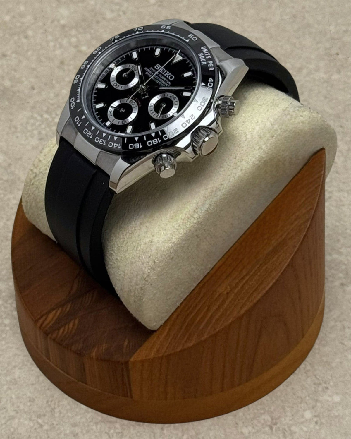 PB TimePiece black chronograph watch with stainless steel 39mm case, black dial, and black rubber strap on display