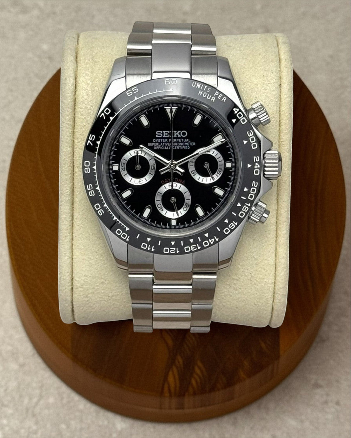PB TimePiece black chronograph watch with stainless steel 39mm case, black bezel, and polished oyster bracelet.