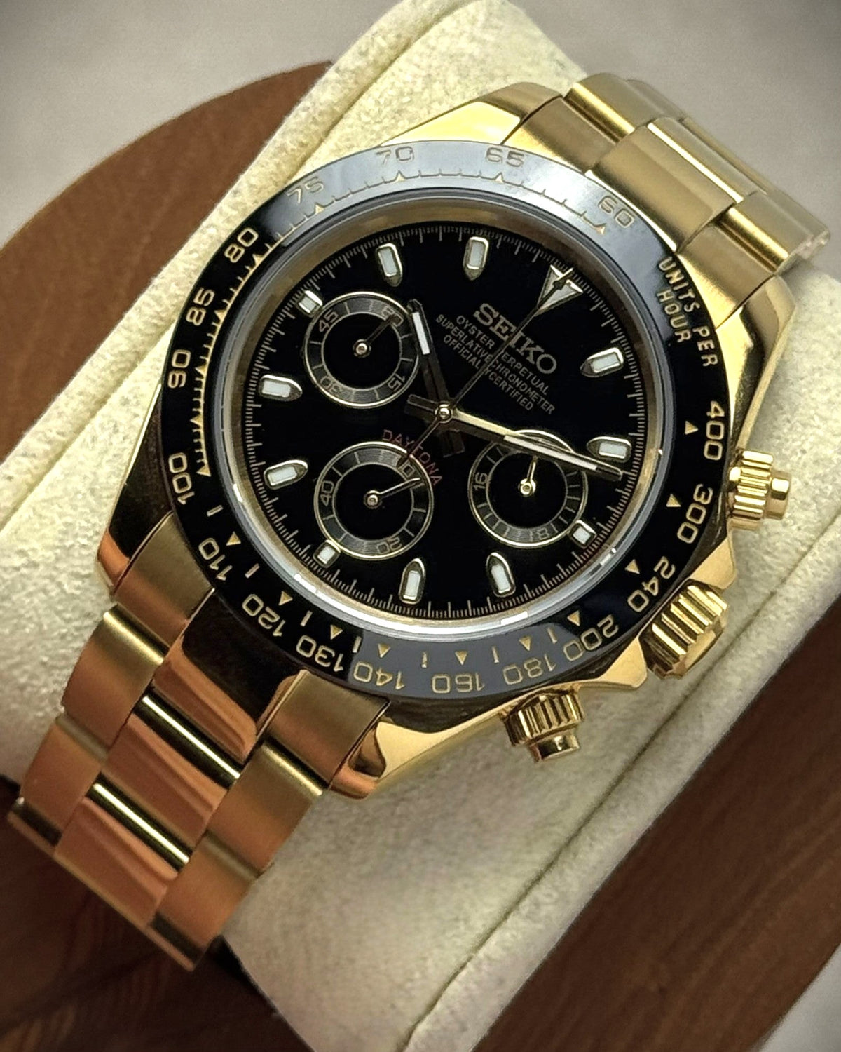 PB TimePiece Bumblebee chronograph watch with a 39mm gold case, black dial, and polished gold oyster bracelet.