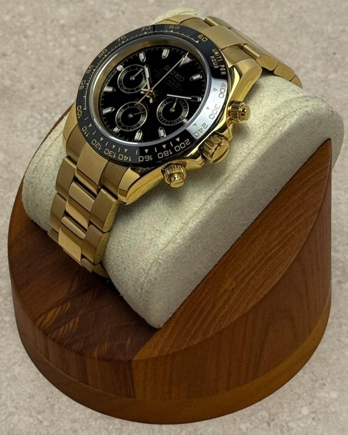 PB TimePiece Bumblebee chronograph watch with a 39mm gold case, black dial, and polished gold oyster bracelet.