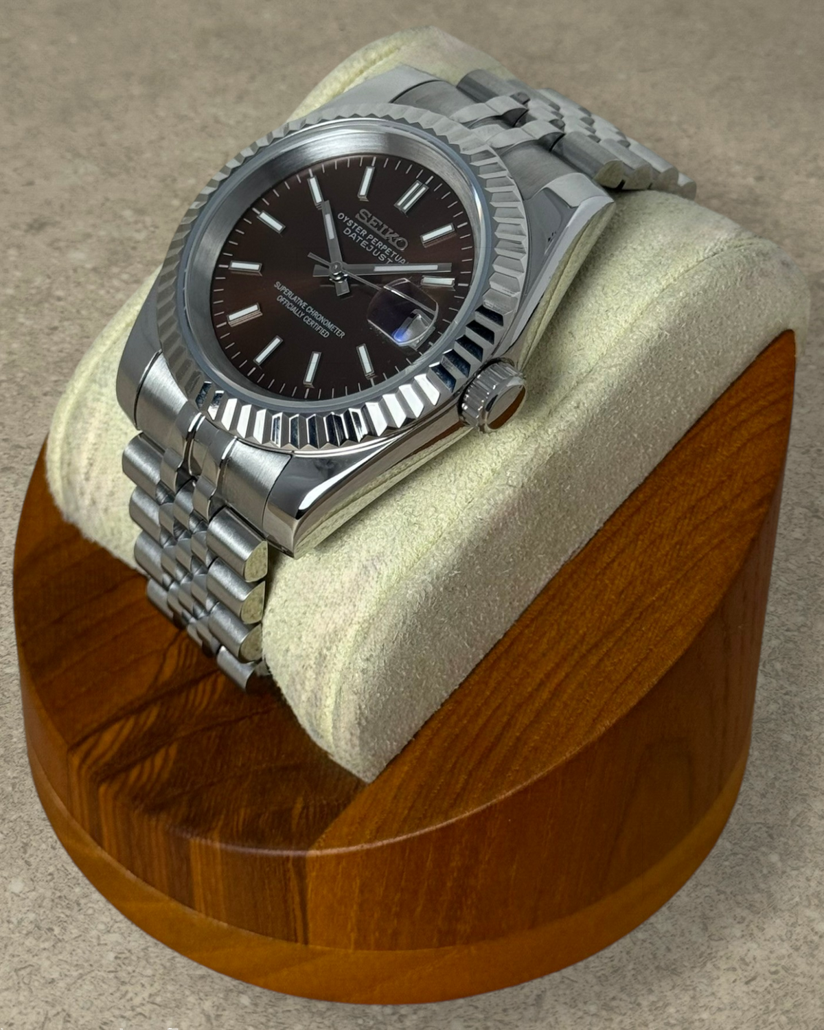 PB TimePiece Classic Date watch with a chocolate dial, stainless steel jubilee bracelet, and fluted bezel.