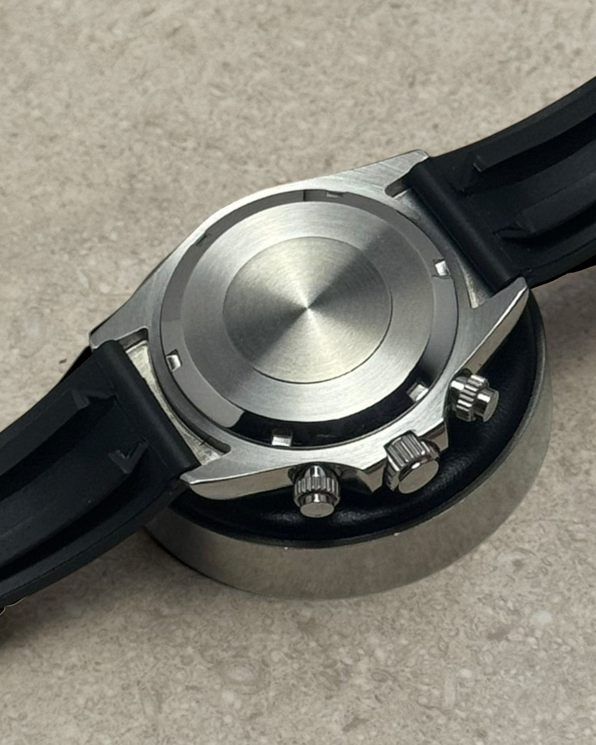 PB TimePiece chronograph watch back view showing stainless steel case and black rubber strap