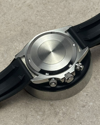 PB TimePiece chronograph watch back view showing stainless steel case and black rubber strap