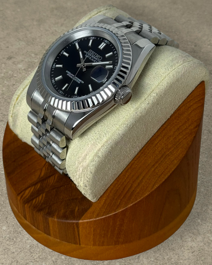 PB TimePiece Classic Date watch with a black dial, fluted bezel, and stainless steel jubilee bracelet.