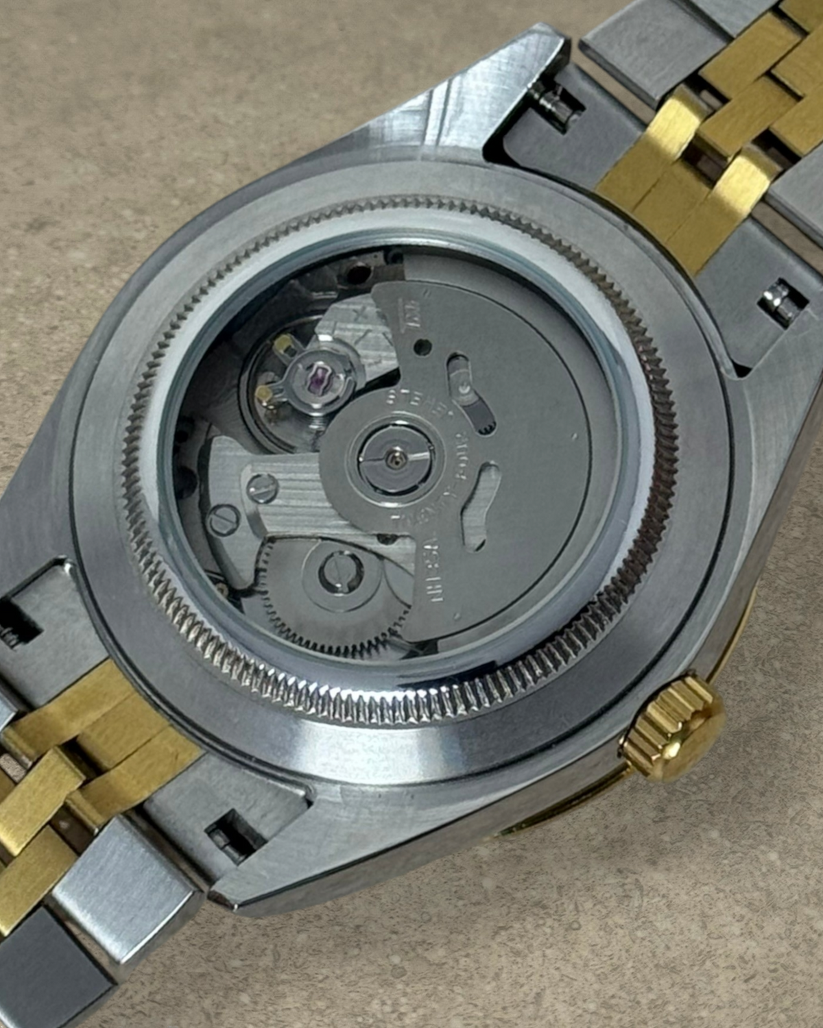 PB TimePiece Classic Date watch showing the exhibition case back with the automatic Seiko NH35 movement