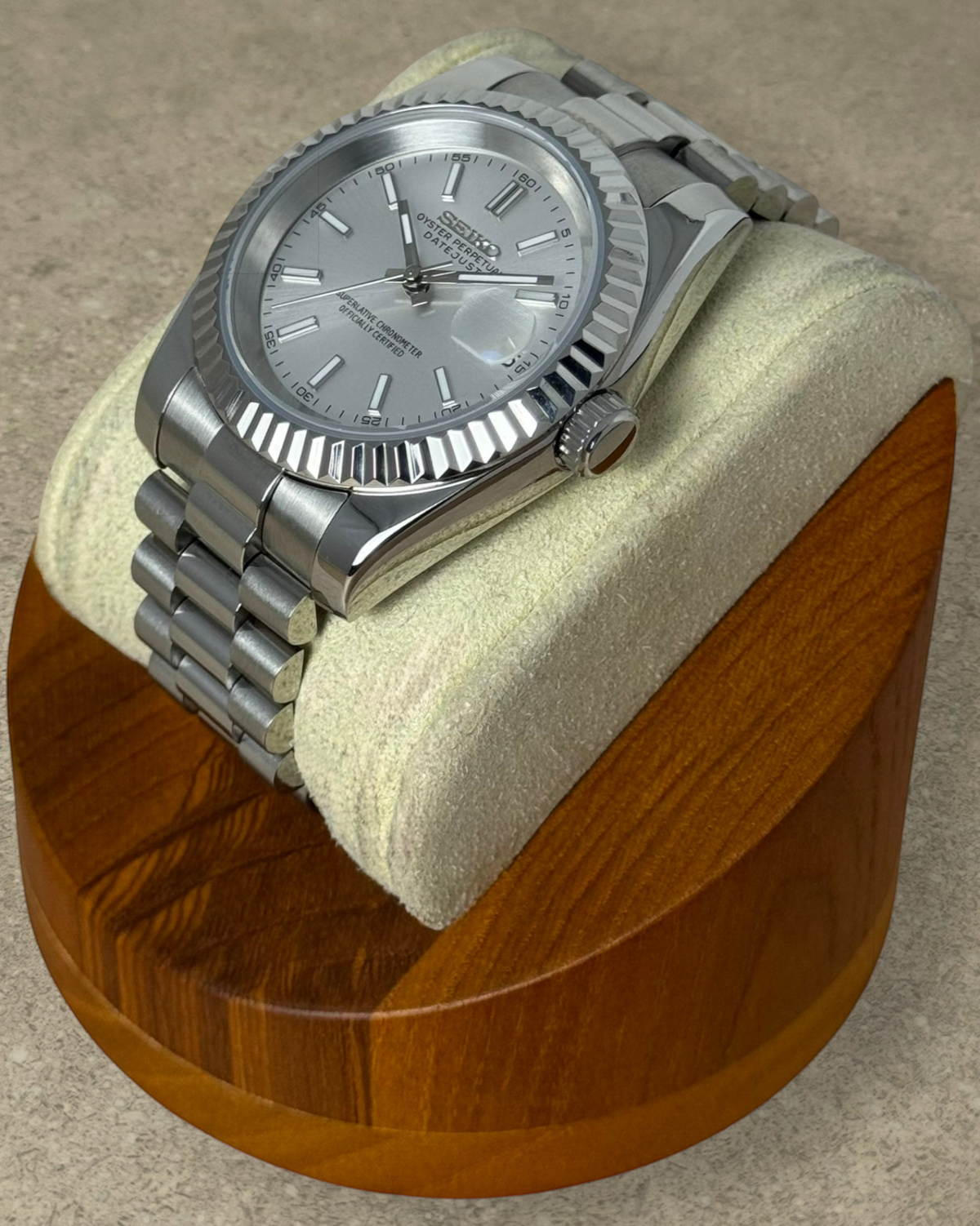 PB TimePiece Classic Date watch with a silver dial, stainless steel presidential bracelet, and fluted bezel.