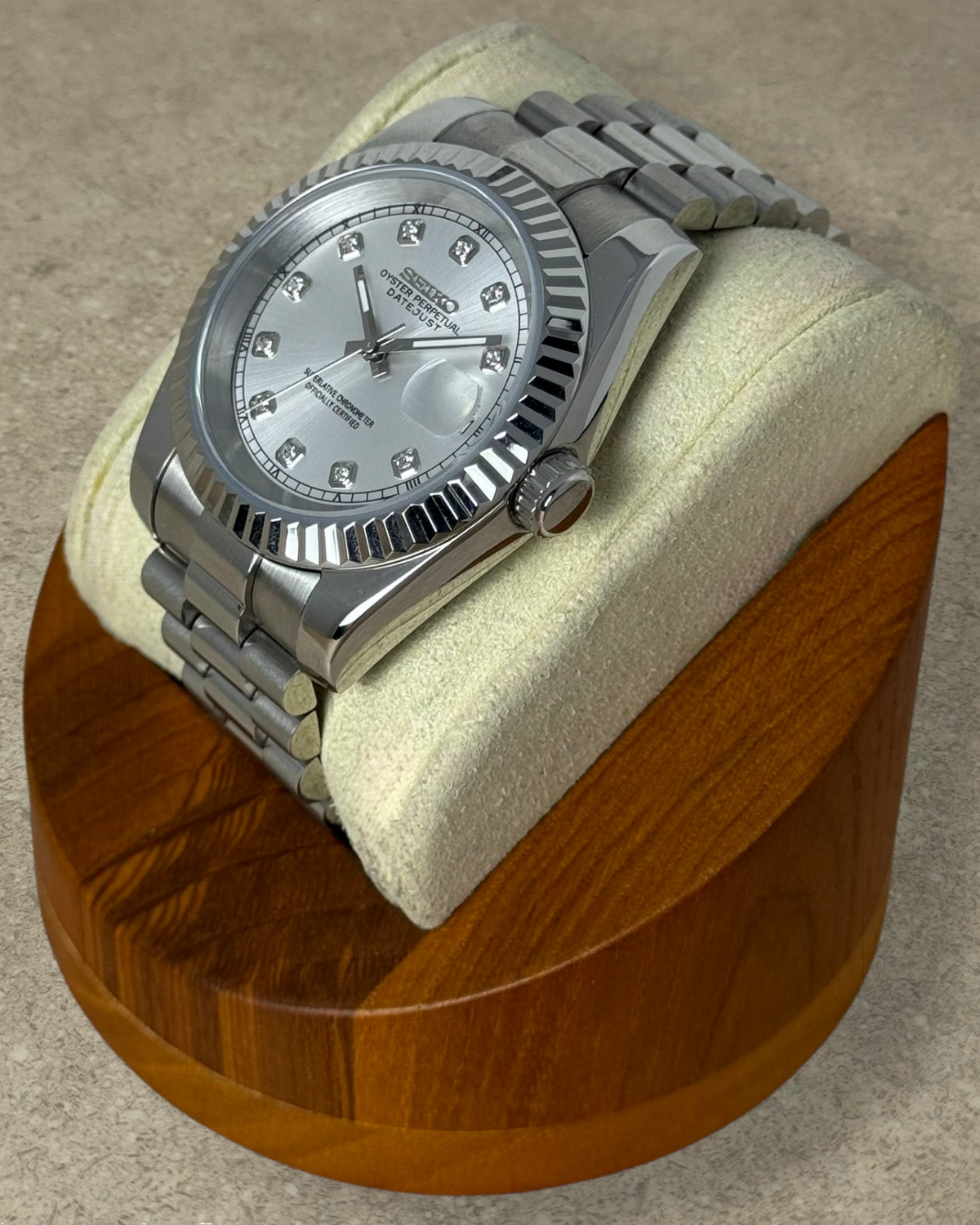 PB TimePiece Classic Date watch with silver dial, crystal markers, fluted bezel, and stainless steel bracelet.