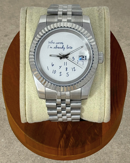 PB TimePiece Classic Date watch with stainless steel jubilee bracelet, fluted bezel, and whimsical late dial design.