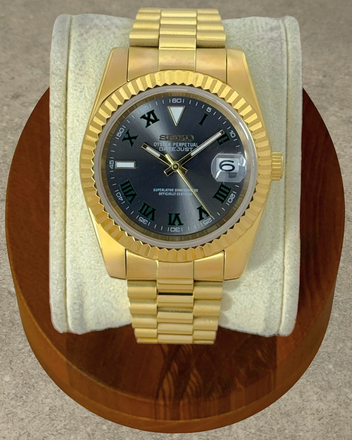 PB TimePiece Classic Date gold stainless steel watch with Wimbledon dial, fluted bezel, and presidential bracelet.
