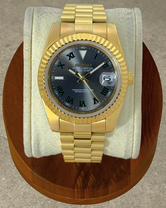 PB TimePiece Classic Date gold stainless steel watch with Wimbledon dial, fluted bezel, and presidential bracelet.
