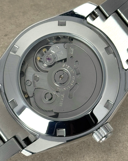 PB TimePiece Heritage watch showing the exhibition case back with Seiko NH35 automatic movement and steel bracelet