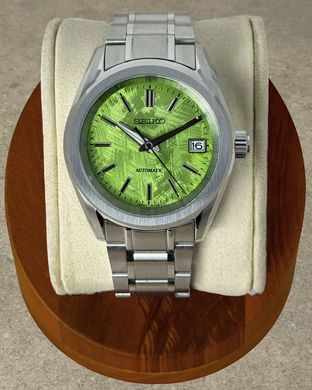 PB TimePiece Heritage watch with a pistachio green textured dial, stainless steel case, and matching metal bracelet.