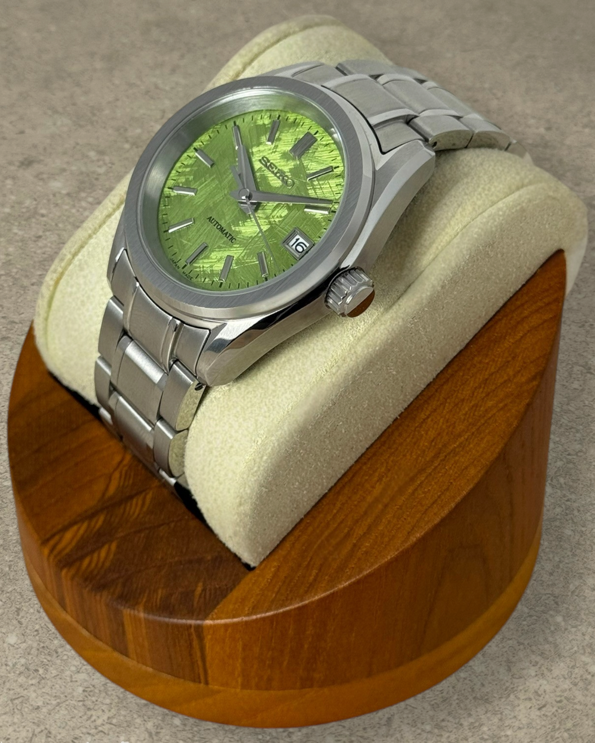 PB TimePiece Heritage watch with a pistachio green textured dial, stainless steel case, and matching metal bracelet.