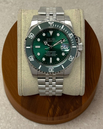 PB TimePiece Submariner Hulk watch with emerald green dial, rotating green bezel, and stainless steel jubilee bracelet
