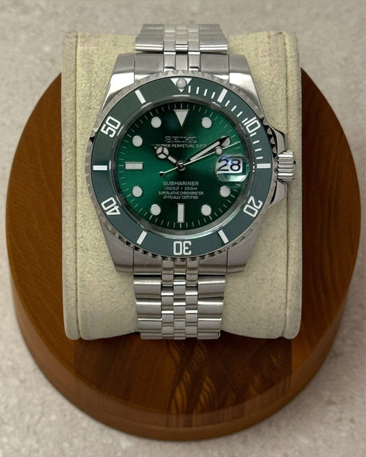 PB TimePiece Submariner Hulk watch with emerald green dial, rotating green bezel, and stainless steel jubilee bracelet