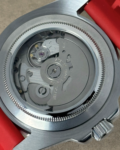 PB TimePiece Marinemaster watch showing the automatic Seiko NH35 movement through a stainless steel exhibition case
