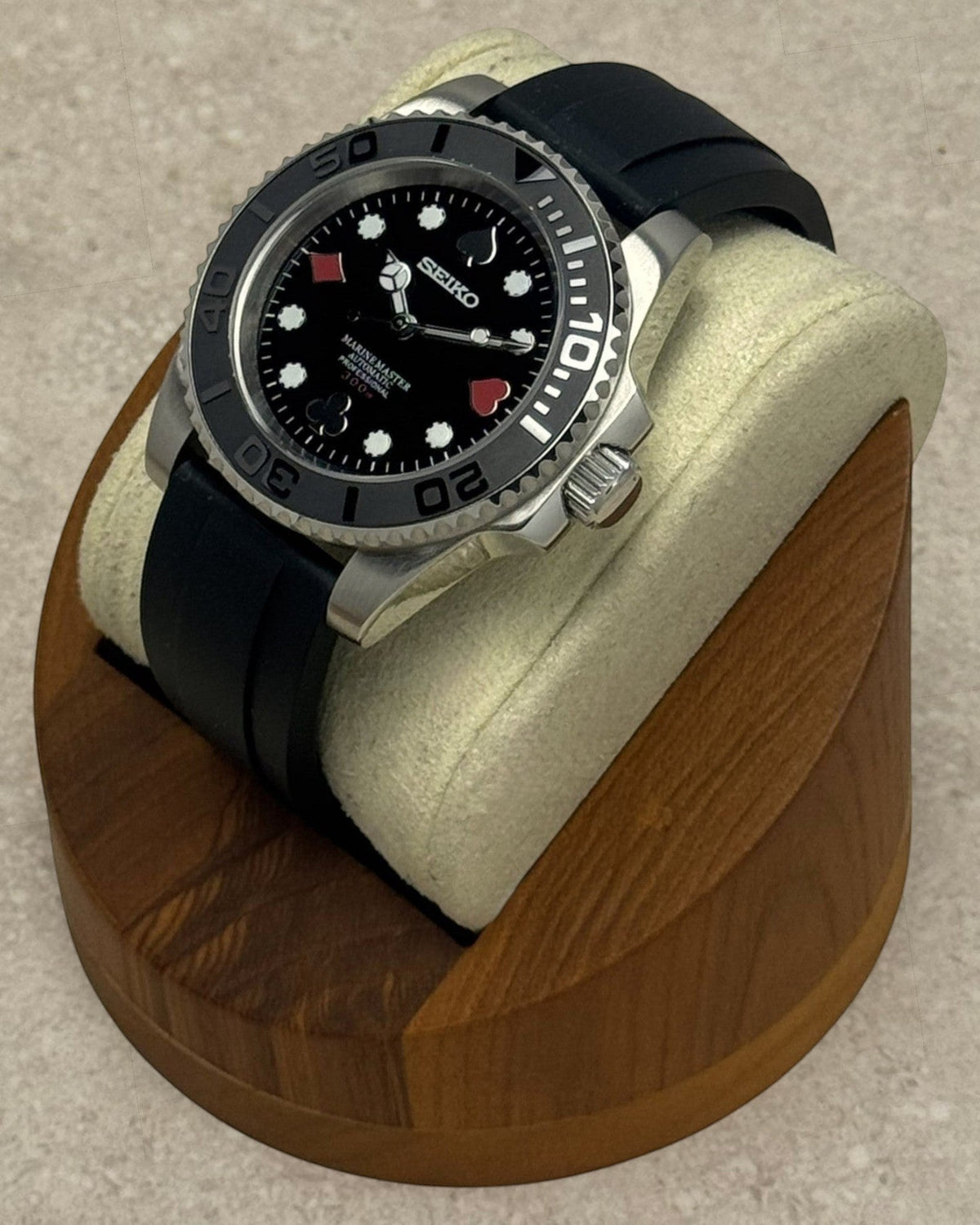 PB TimePiece Marinemaster Poker Face watch with black rubber strap, stainless steel case, and matte black bezel.