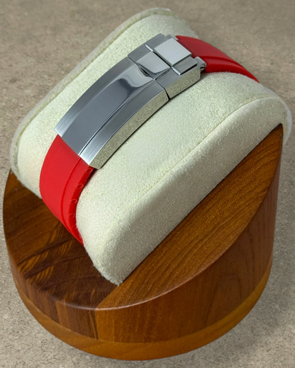 PB TimePiece Marinemaster watch featuring a vibrant red rubber strap and a polished stainless steel deployment clasp.