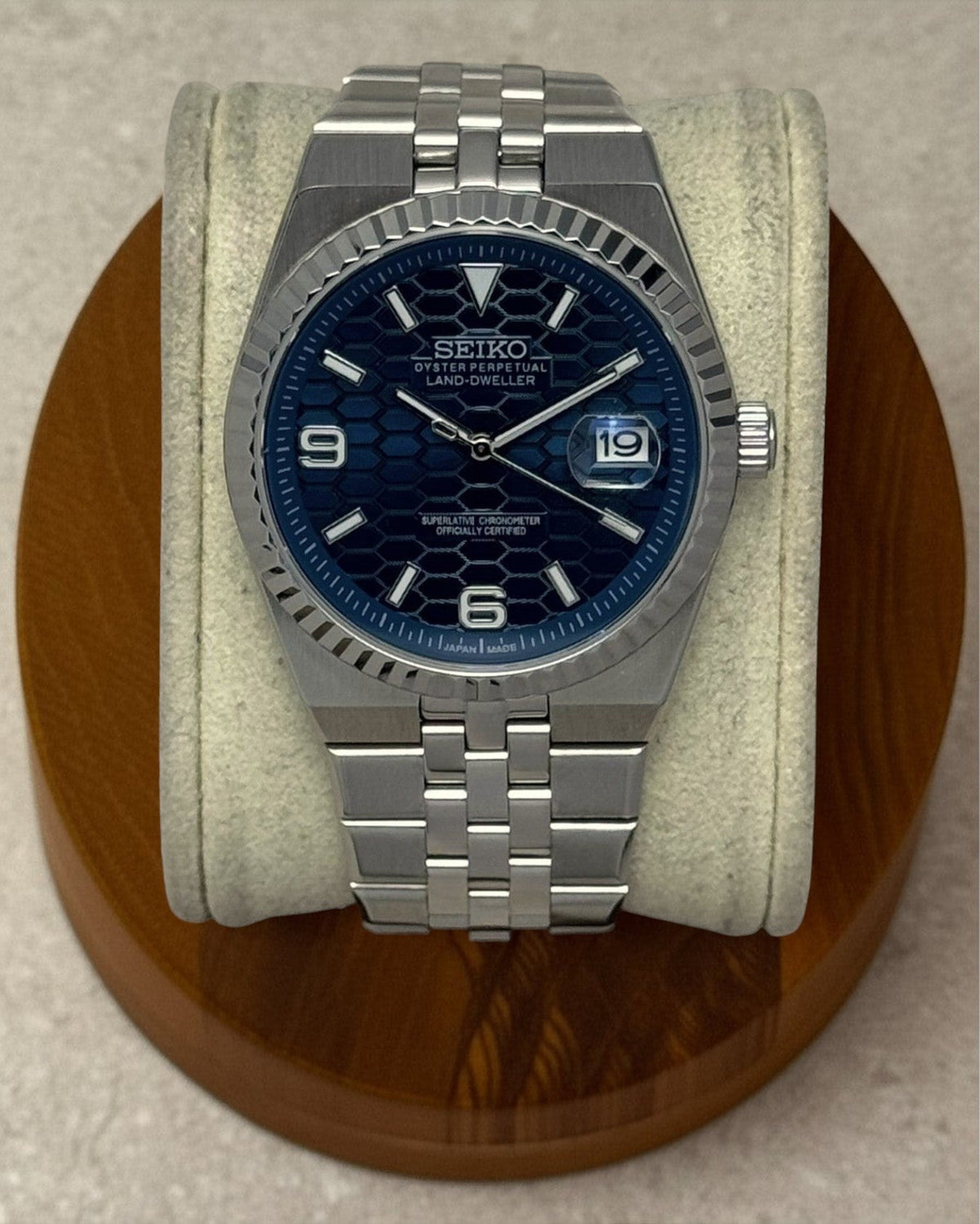 PB TimePiece Honeycomb navy blue watch with stainless steel jubilee bracelet, fluted bezel, and sapphire crystal.