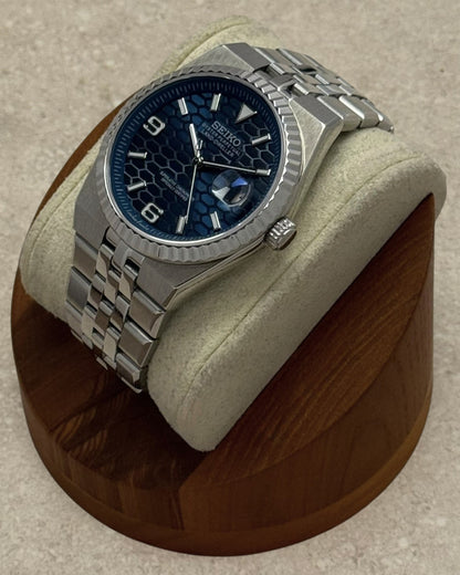 PB TimePiece Honeycomb navy blue watch with stainless steel jubilee bracelet, fluted bezel, and sapphire crystal.
