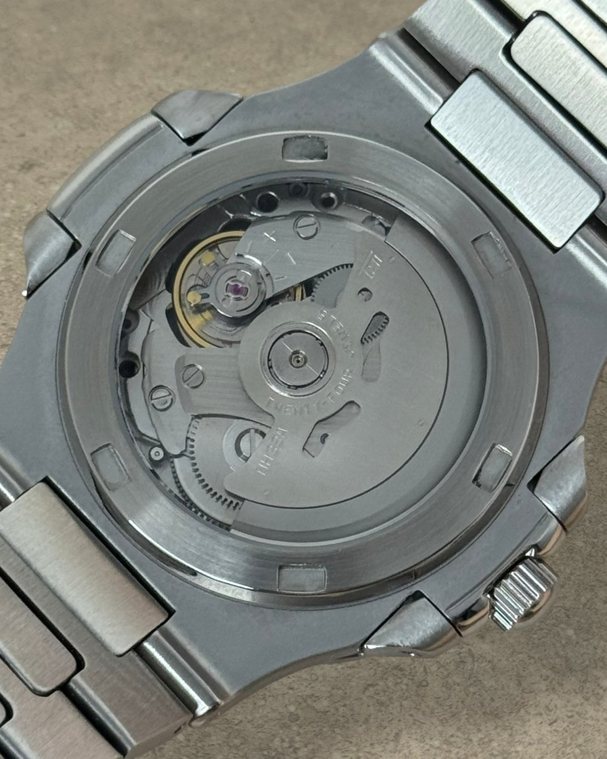 PB TimePiece Novara watch exhibition case back showing the automatic Seiko NH35 movement and stainless steel bracelet