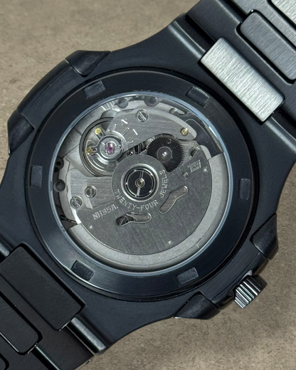 PB TimePiece Novara watch showing the automatic Seiko NH35A movement through the black stainless steel case back