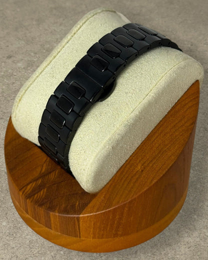 PB TimePiece Novara black stainless steel watch bracelet with butterfly clasp on a display stand