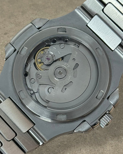 PB TimePiece Novara watch featuring an exhibition case back showing the automatic Seiko NH70 movement in steel