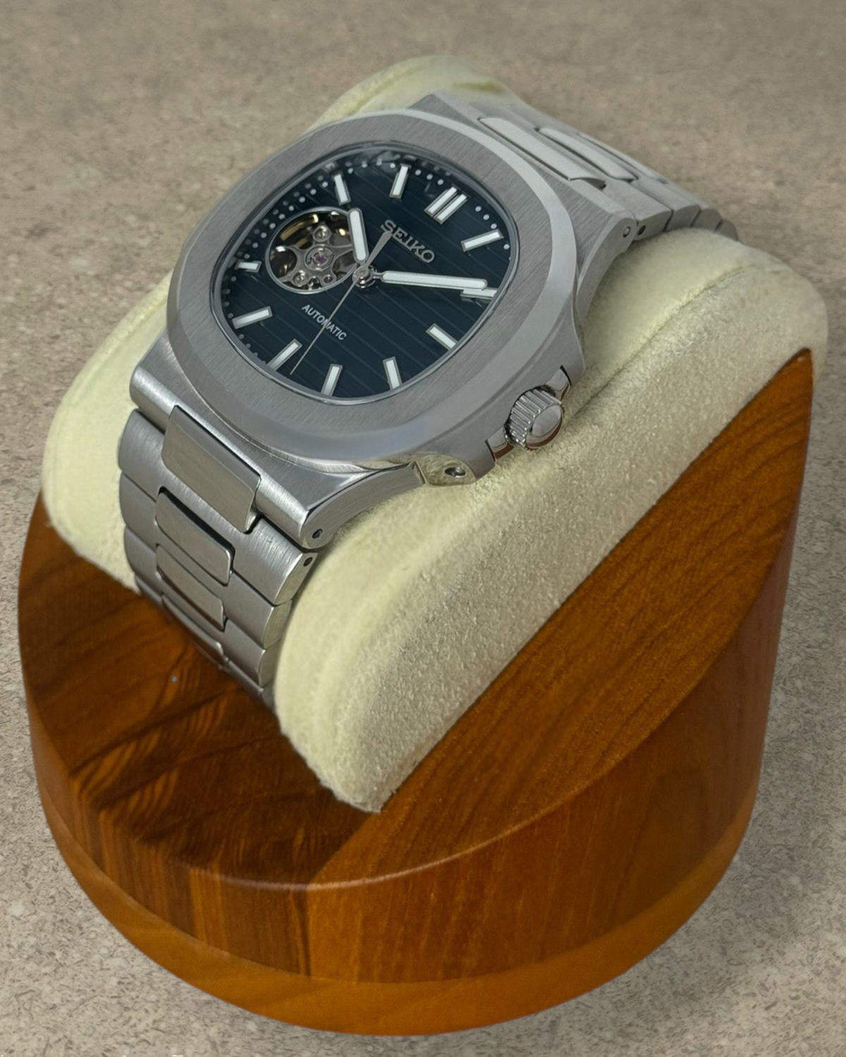 PB TimePiece Novara automatic watch with a forest green open heart dial, stainless steel case, and bracelet.