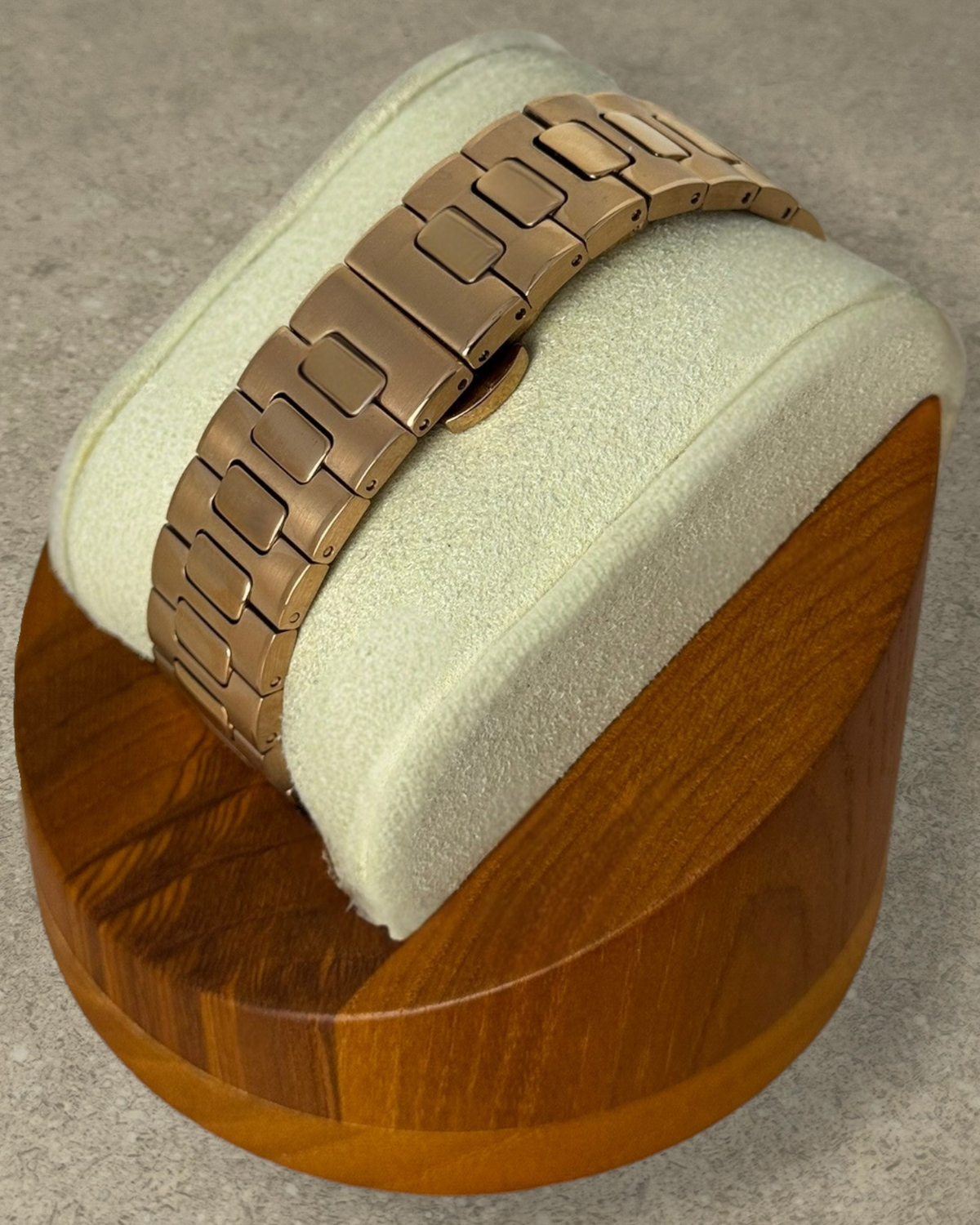 PB TimePiece Novara rose gold stainless steel watch bracelet with butterfly clasp on a display stand