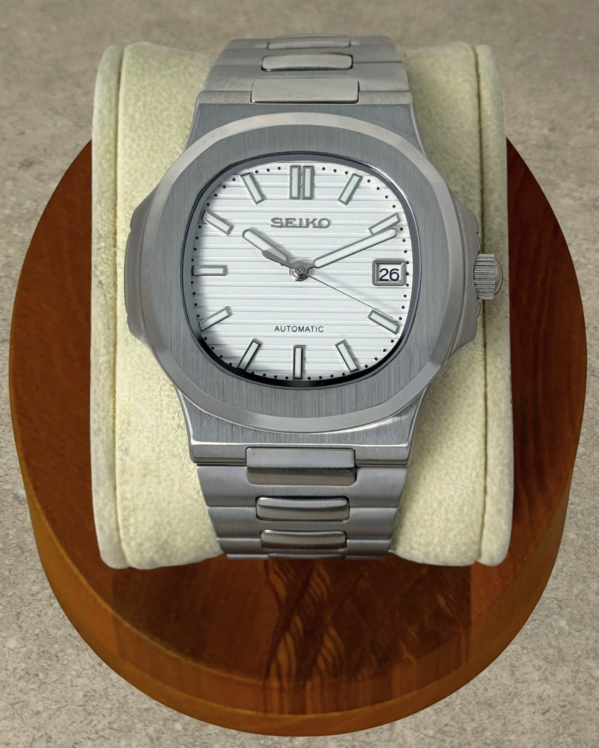 PB TimePiece Novara white automatic watch with a 40mm stainless steel case, textured dial, and brushed bracelet.