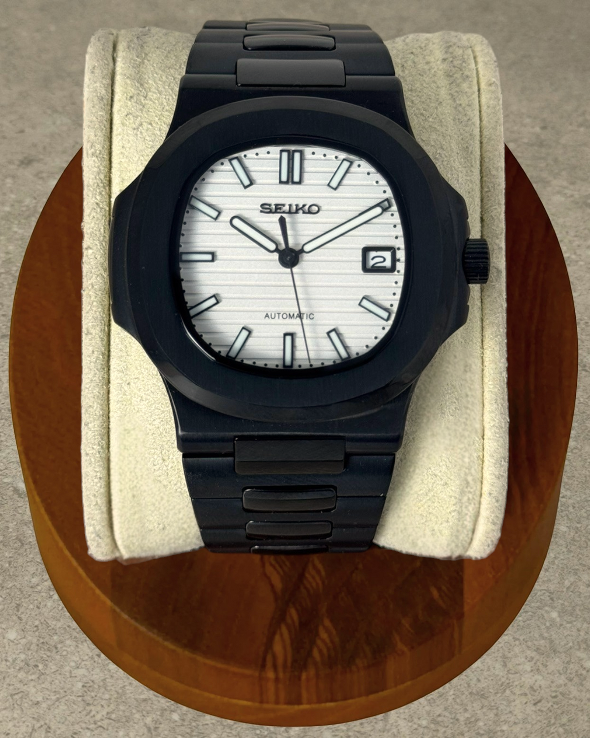 PB TimePiece Novara watch featuring a textured white dial, black stainless steel case, and matching black bracelet.