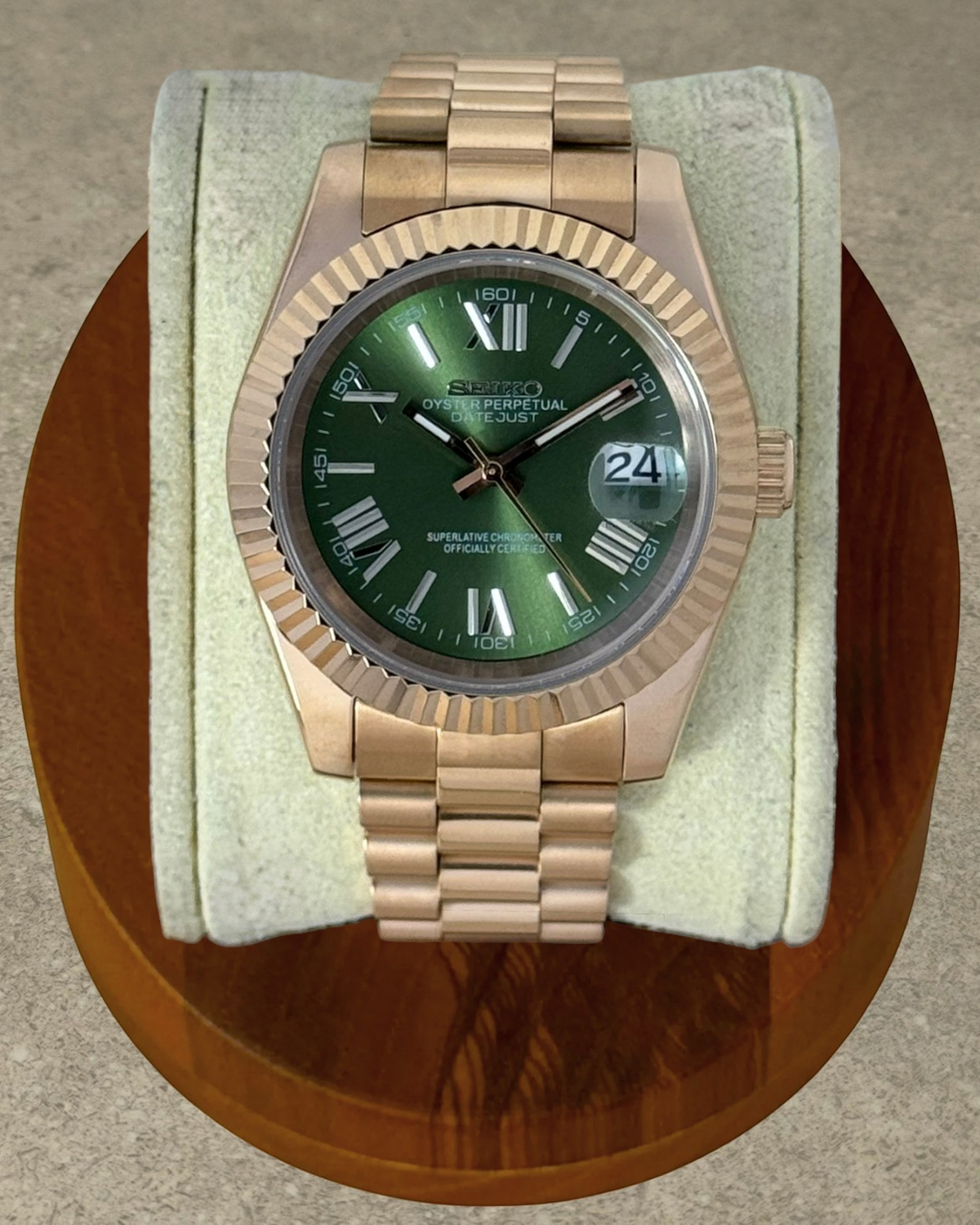 PB TimePiece Classic Date watch with olive green dial, rose gold stainless steel case, fluted bezel, and bracelet.