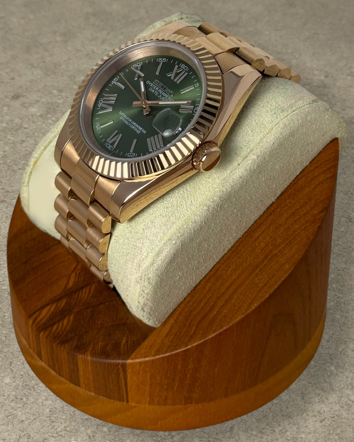 PB TimePiece Classic Date watch with olive green dial, rose gold stainless steel case, and fluted bezel.