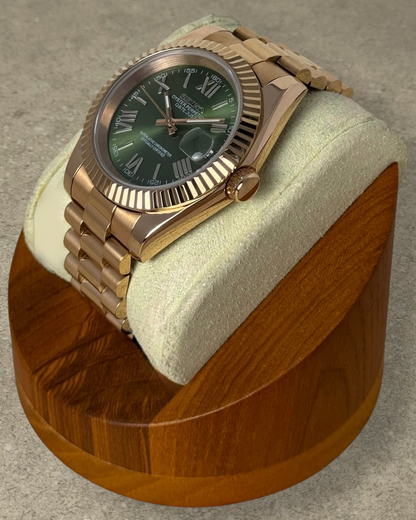 PB TimePiece Classic Date watch with olive green dial, rose gold stainless steel case, and fluted bezel.
