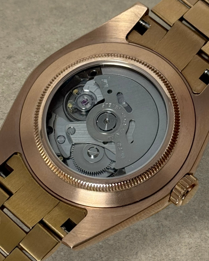 PB TimePiece Classic Date watch showing the exhibition case back with Seiko NH35 automatic movement and rose gold case