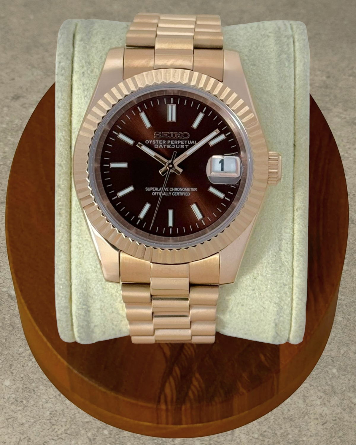 PB TimePiece Classic Date watch with a rose gold stainless steel case, fluted bezel, and chocolate brown dial.