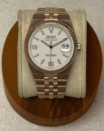 PB TimePiece Honeycomb watch with a rose gold jubilee bracelet, fluted bezel, and white textured honeycomb dial.
