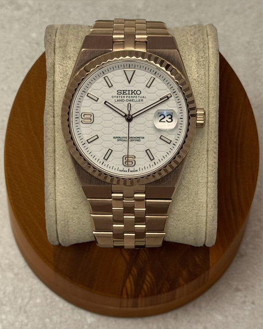 PB TimePiece Honeycomb watch with a rose gold jubilee bracelet, fluted bezel, and white textured honeycomb dial.
