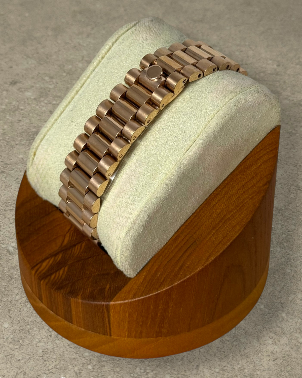 PB TimePiece rose gold presidential watch bracelet with hidden clasp on a display stand