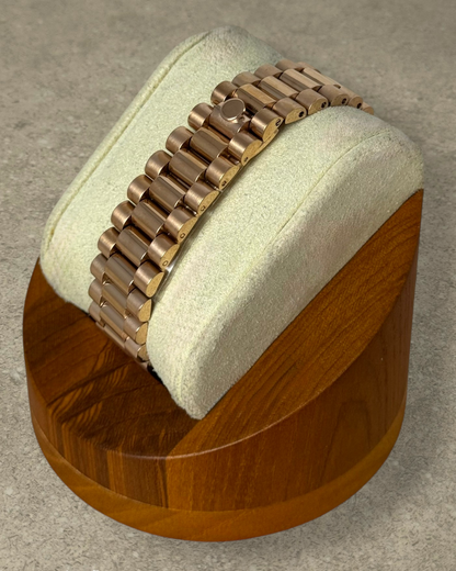 PB TimePiece rose gold presidential watch bracelet with hidden clasp on a display stand