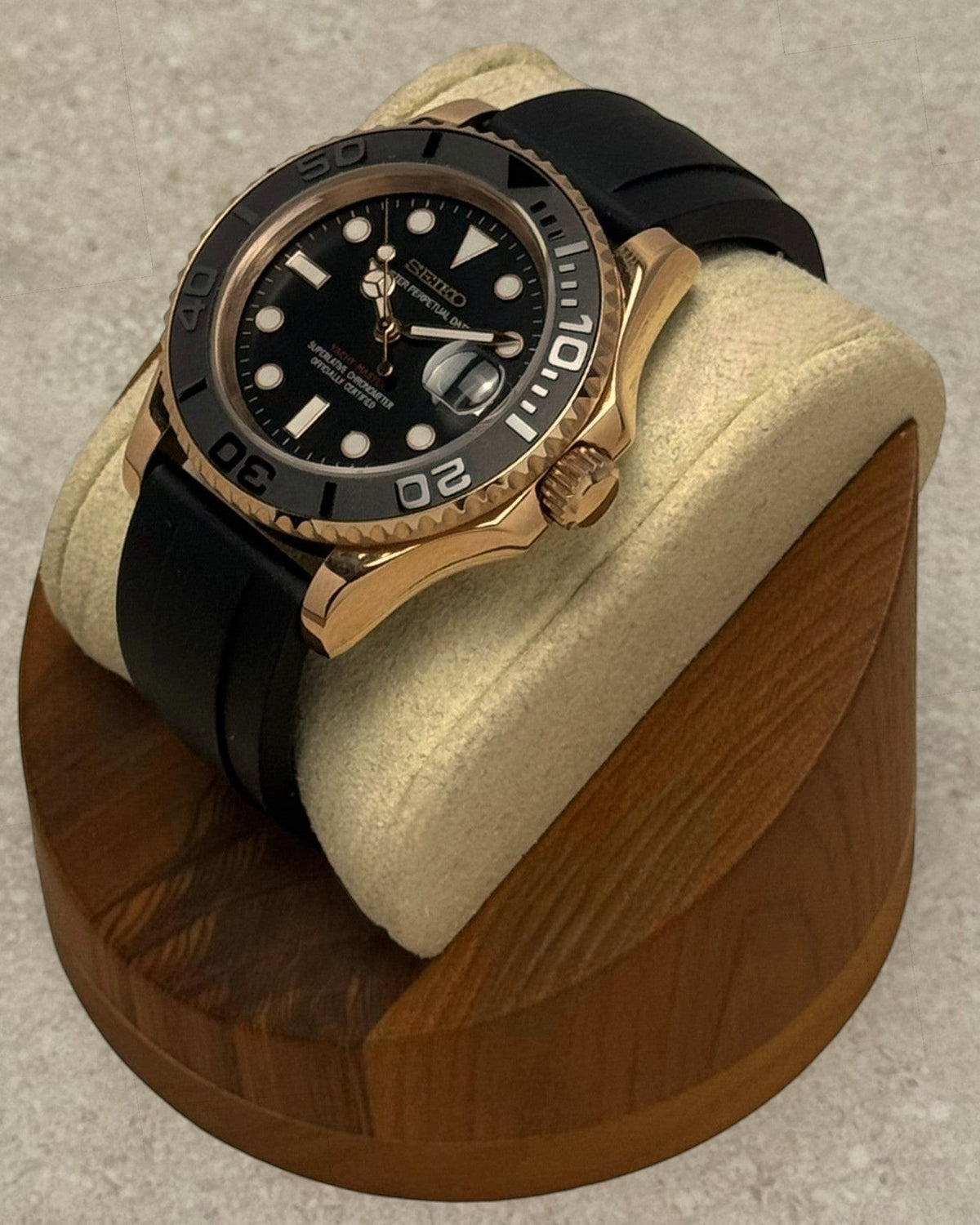 PB TimePiece Yachtmaster watch with a rose gold 40mm case, black dial, rotating matte bezel, and black rubber strap.