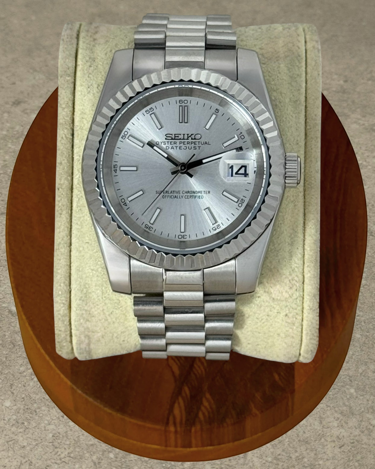 PB TimePiece Classic Date watch with silver dial, fluted bezel, and stainless steel presidential bracelet.