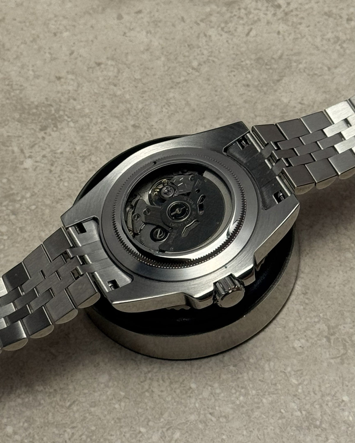 PB TimePiece Submariner Batman watch showing the stainless steel case back and automatic Seiko NH35 movement
