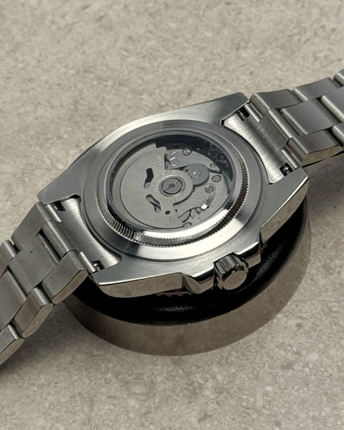 PB TimePiece Submariner watch showing the stainless steel case back and exhibition window for the NH35 movement.