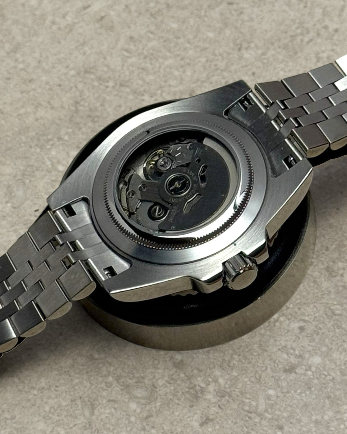 PB TimePiece Submariner Hulk watch showing the stainless steel jubilee bracelet and open exhibition case back