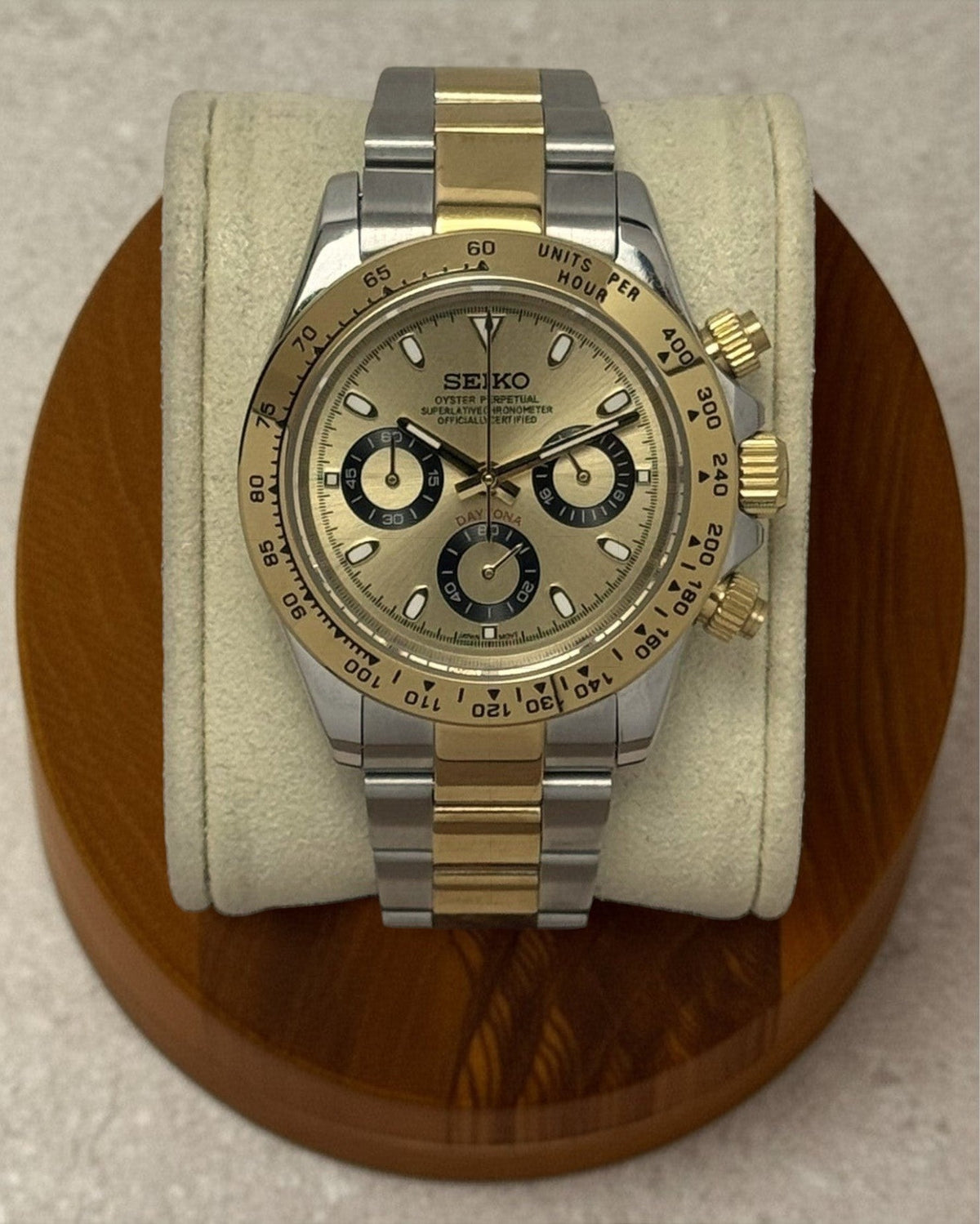 PB TimePiece two-tone gold chronograph watch with champagne dial, stainless steel case, and oyster bracelet.